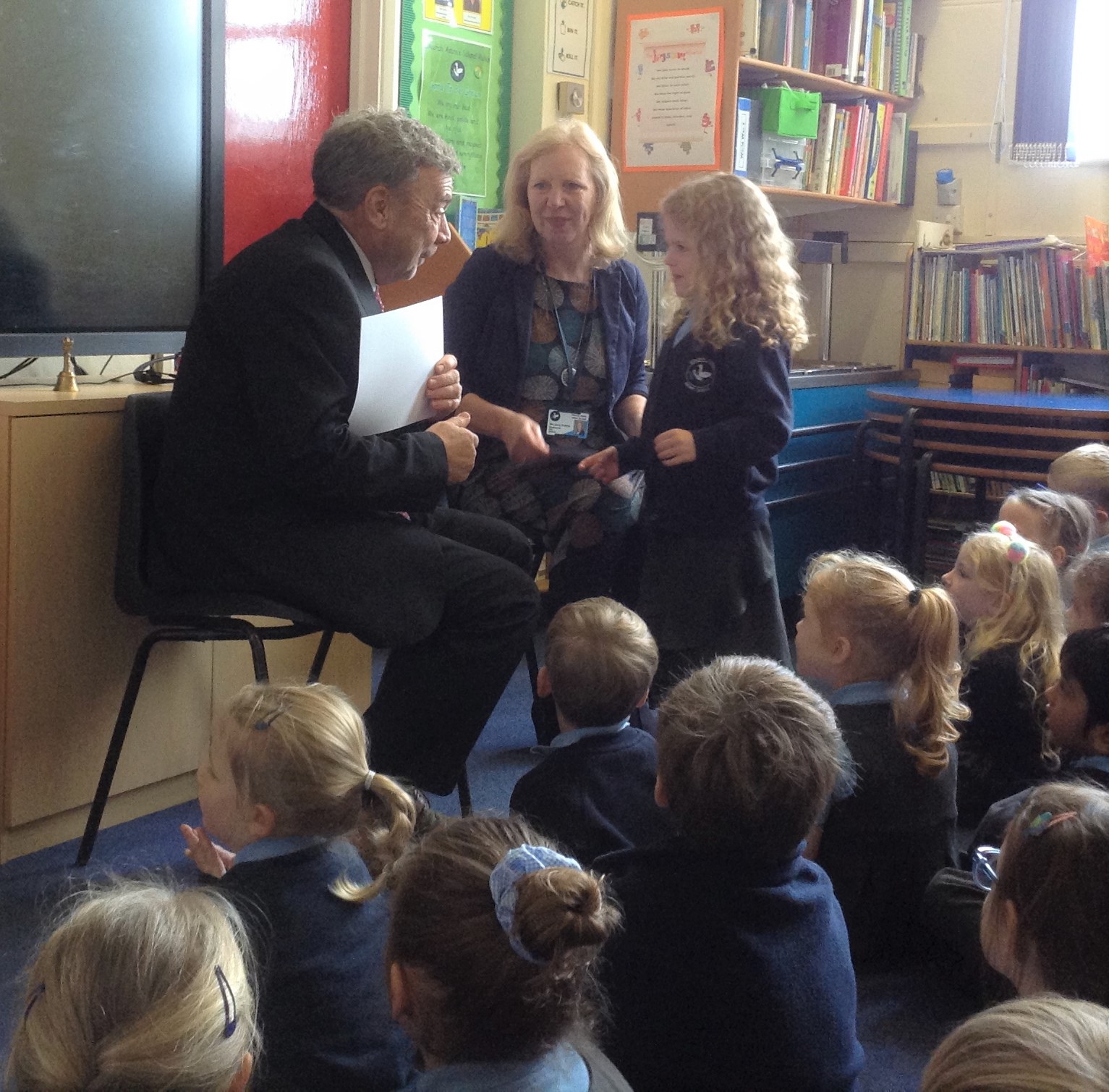 Children receiving their school council certificate